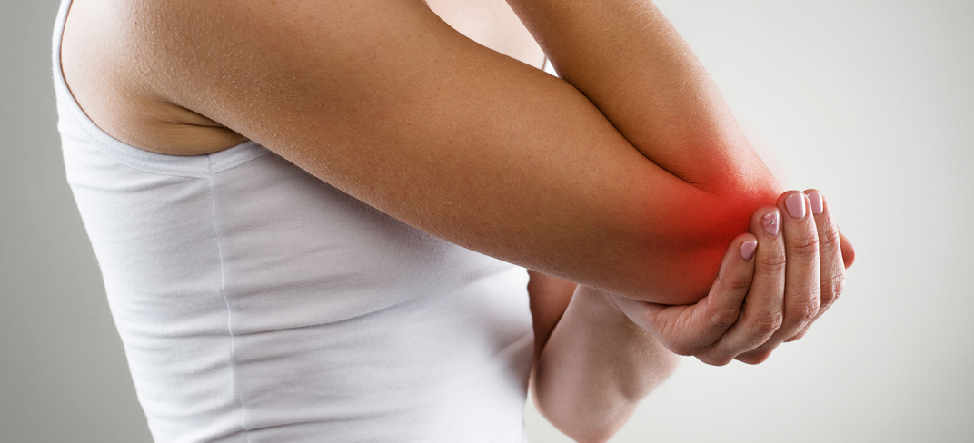 Person holding their elbow