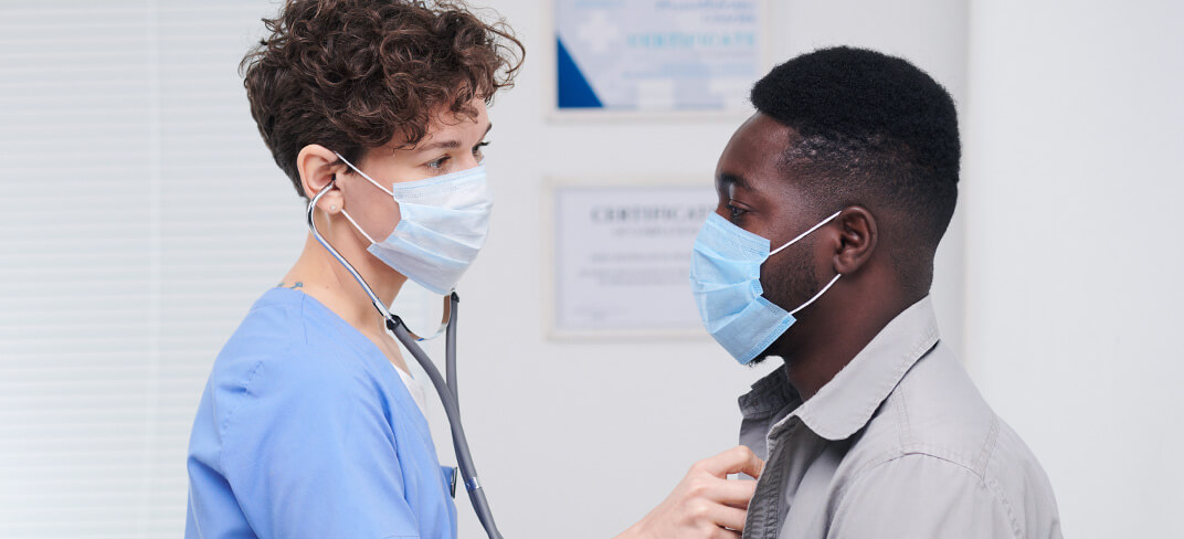 Doctor giving a patient a check up.