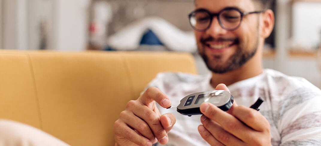 Man testing blood sugar